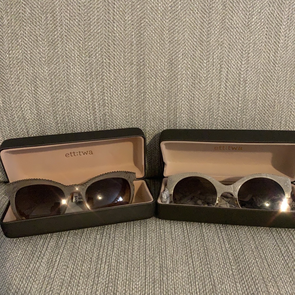 2 pair of ett:twa sunglasses.